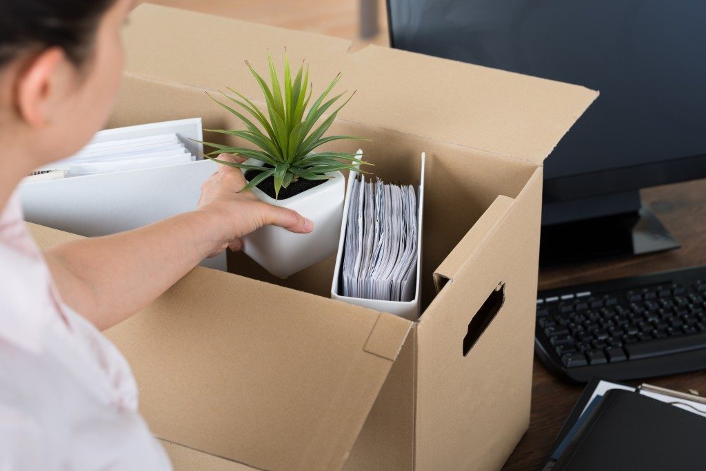 Resigned employee packing her office things